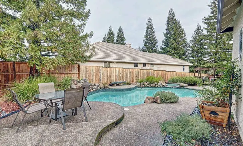 A wood fence around a pool