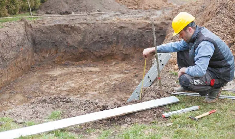 Pool Contractor Measuring Out For A New Pool